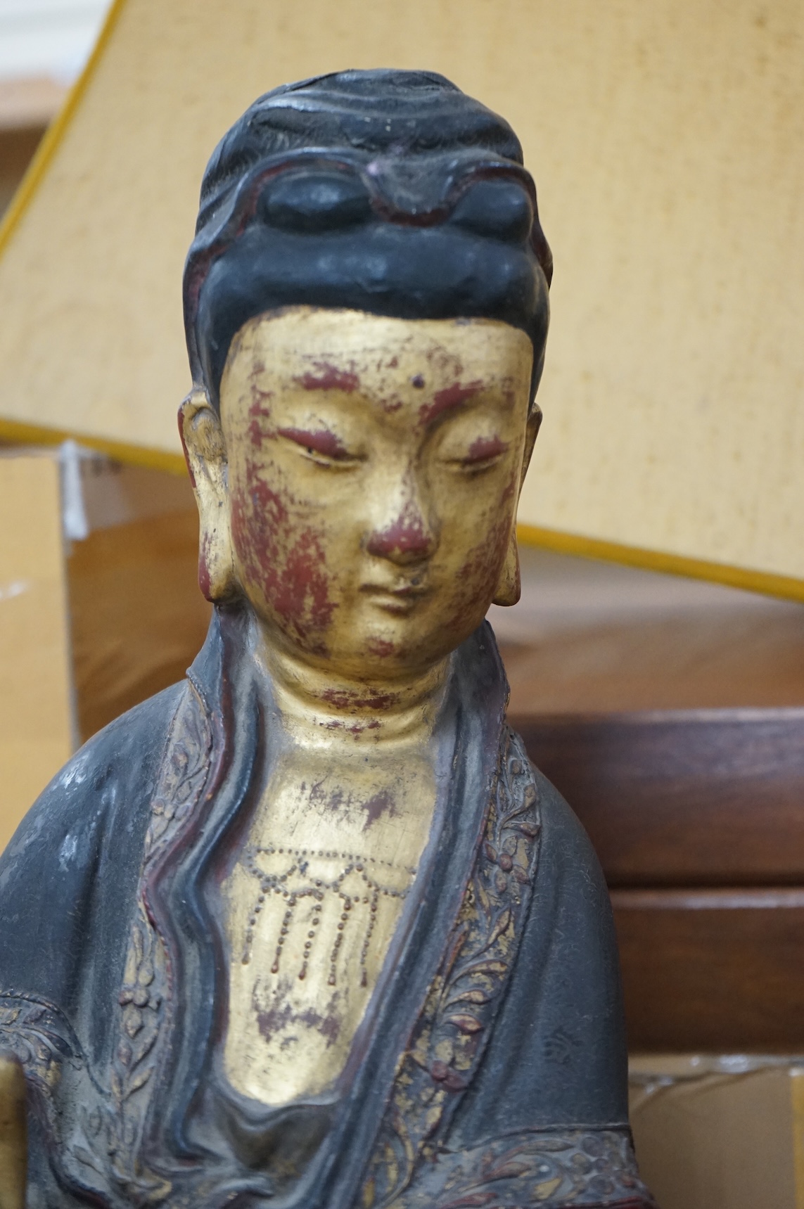 A Chinese partially gilt papier-mâché figure of Guanyin, 63cm high